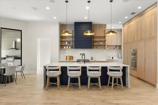 a kitchen with a sink and a refrigerator