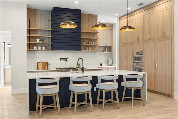 a kitchen with a sink and cabinets