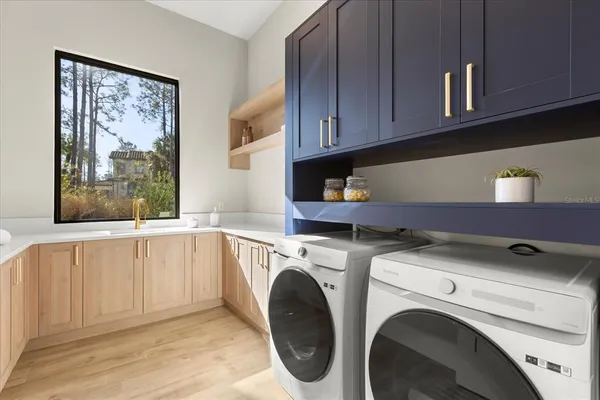 a bedroom with furniture and wooden floor