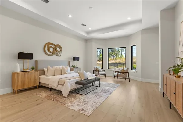a living room with furniture and a mirror