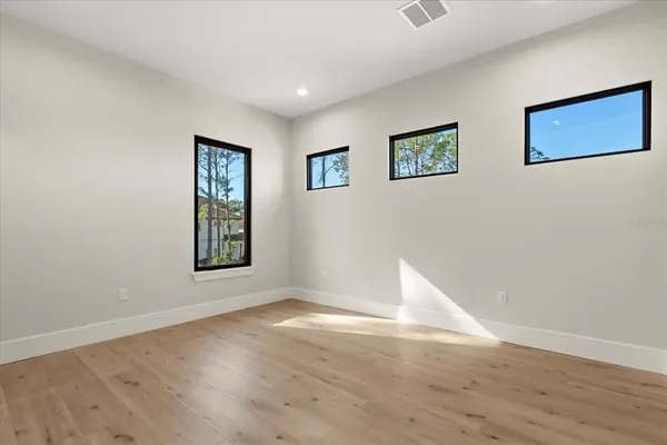 a view of a livingroom with furniture window and wooden floor