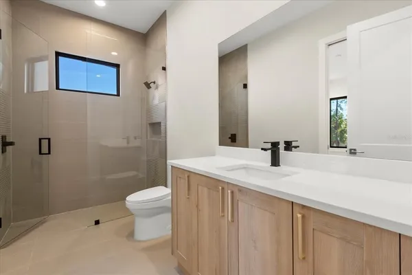 a view of a house with swimming pool and porch with furniture