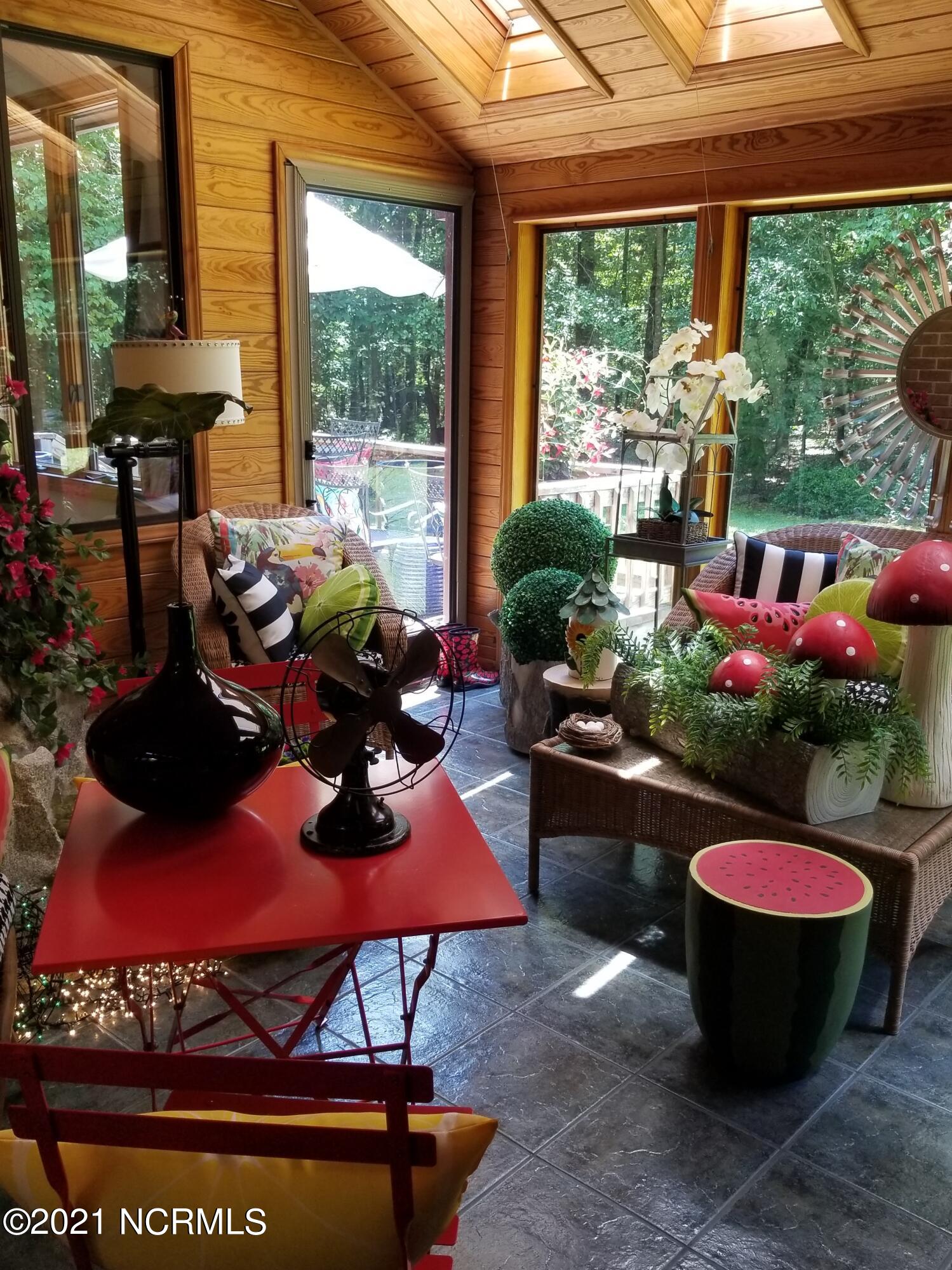 541 Indian Branch Road Rocky Mount, NC 27804 - Photo 13 of 42 Skylights provide sunlight on tiles that absorb and emit heat in the winter.