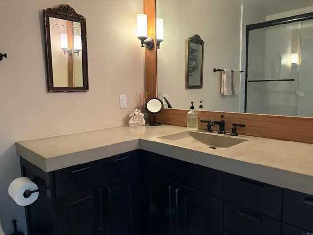 a bedroom with a bed chair and window