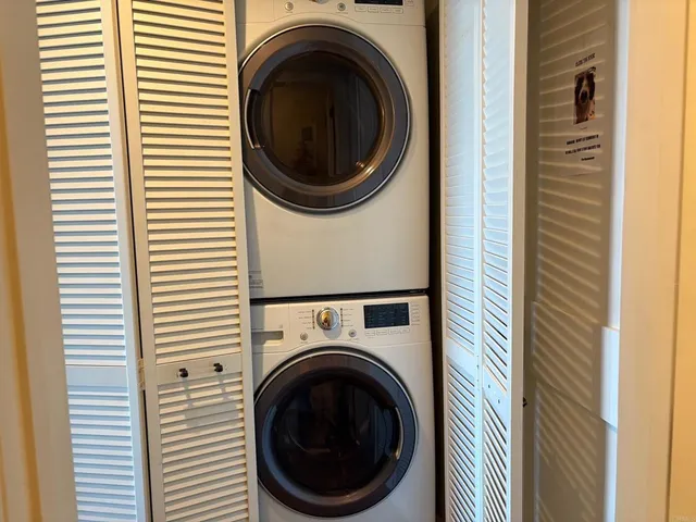 a view of a balcony with chairs and plants