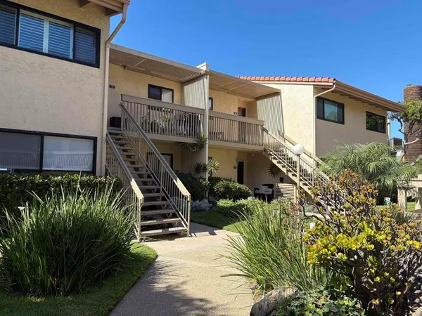 a sign broad in front of the red building