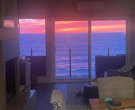 an open kitchen with a sink and cabinets