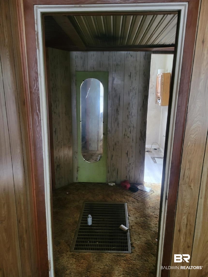 2059 Magnolia Lane Mobile, AL 36605 - Photo 3 of 17 Corridor with wood walls