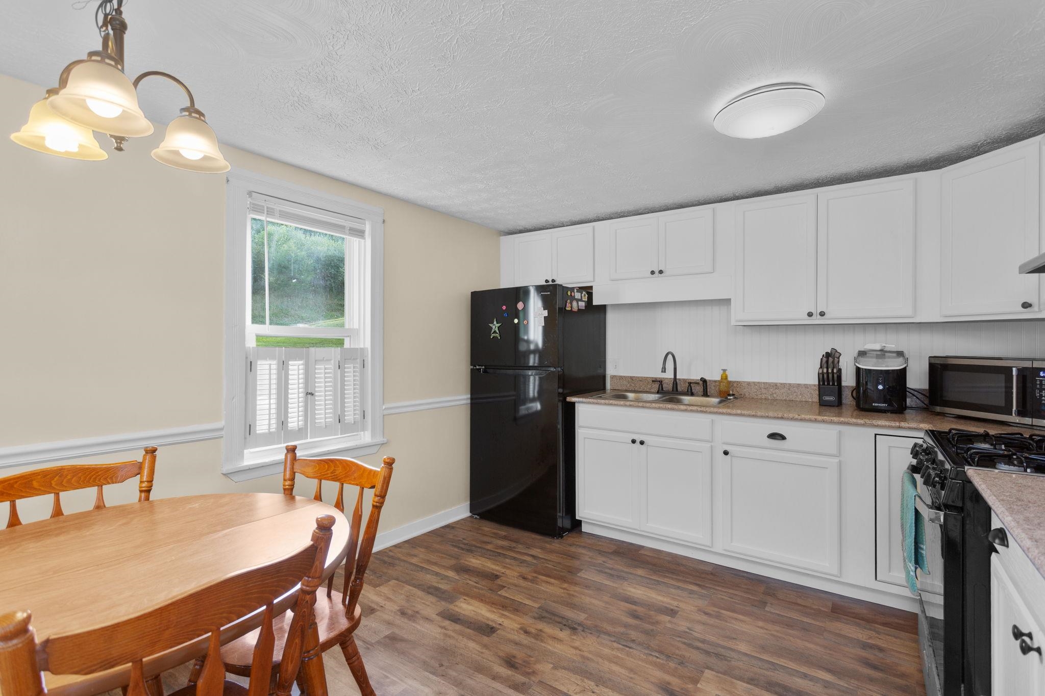 17514 Highway 259 Mathias, WV 26812 - Photo 7 of 24 with updated flooring and door to front porch.