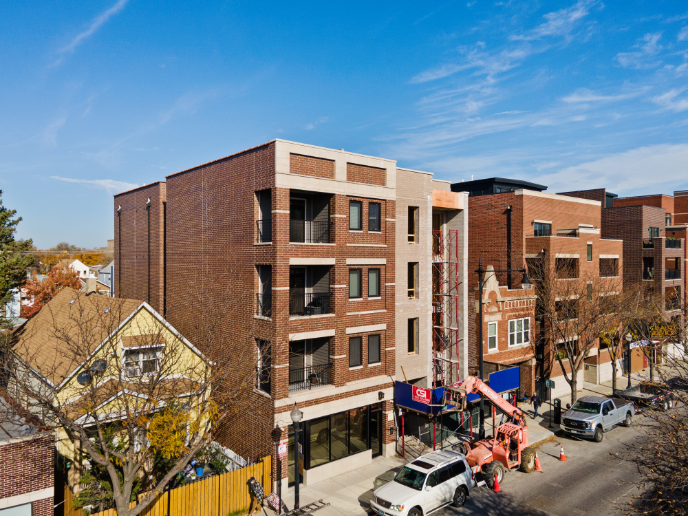 a front view of a building with glass windows