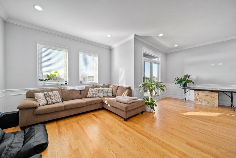 3336 West Irving Park Road, Unit 2 Chicago, IL 60618 - Photo 3 of 9 a living room with furniture and a large window