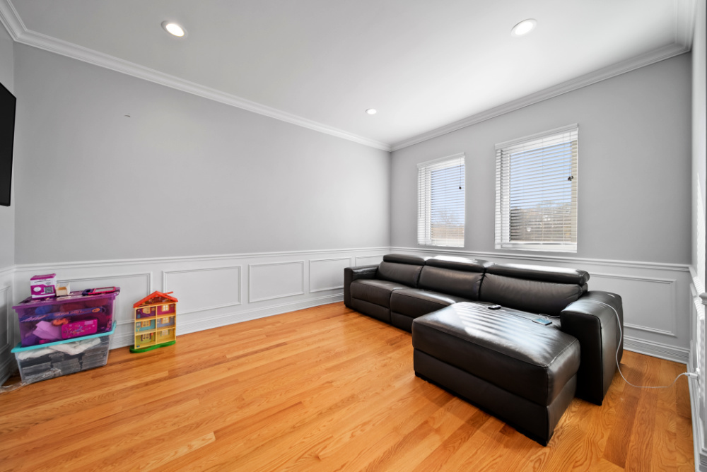 3336 West Irving Park Road, Unit 2 Chicago, IL 60618 - Photo 5 of 9 a living room with furniture and a wooden floor