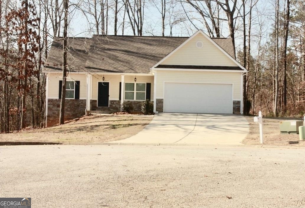 637 Point Oak View Villa Rica, GA 30180 - Photo 1 of 1 a house with trees in front of it