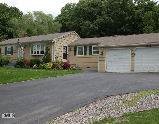 179 Stevenson Road Fairfield, CT 06825 - Photo 1 of 1 a front view of house with yard and green space