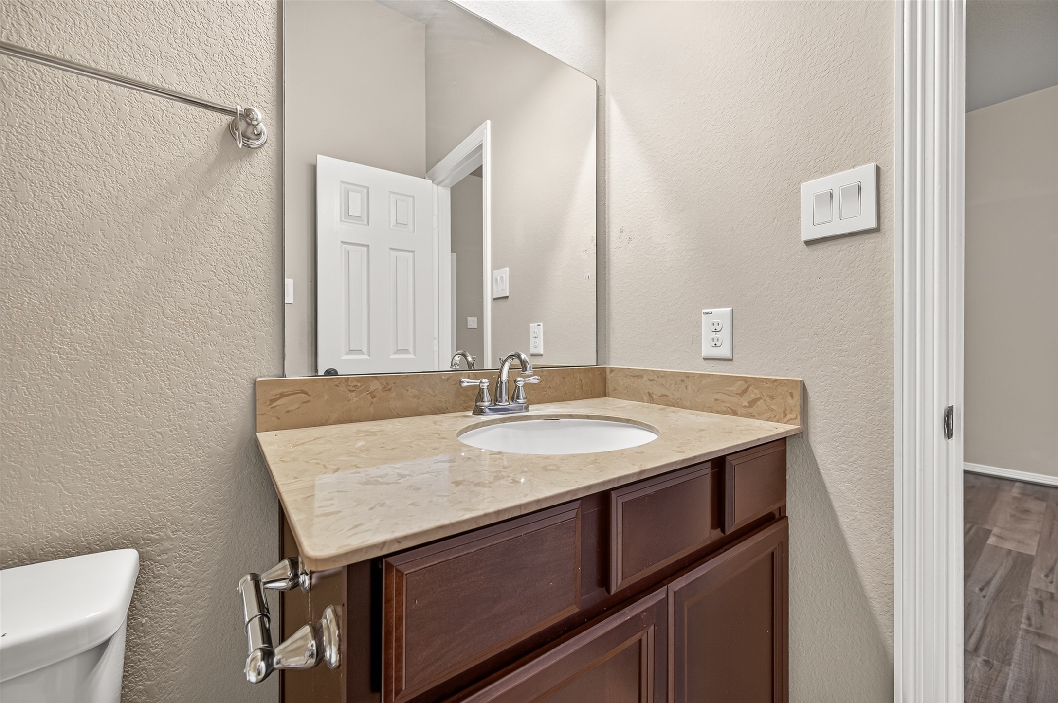 4314 Kent Ranch Court Katy, TX 77494 - Photo 34 of 49 Ensuite bathroom vanity with stone-look countertop and towel bar.