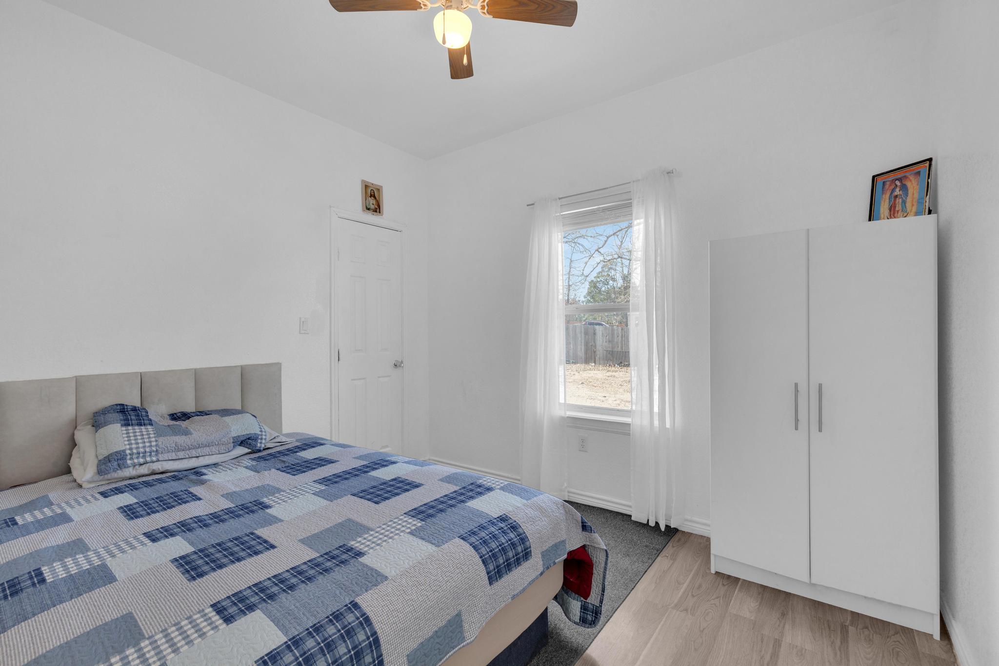 114 Crepe Myrtle Parkway Elgin, TX 78621 - Photo 22 of 40 Unit B - Bedroom featuring light wood-style floors and a ceiling fan