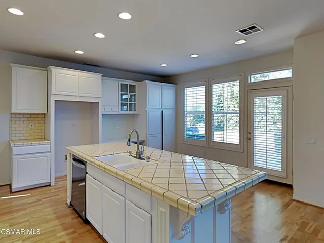 a kitchen with a sink and a window