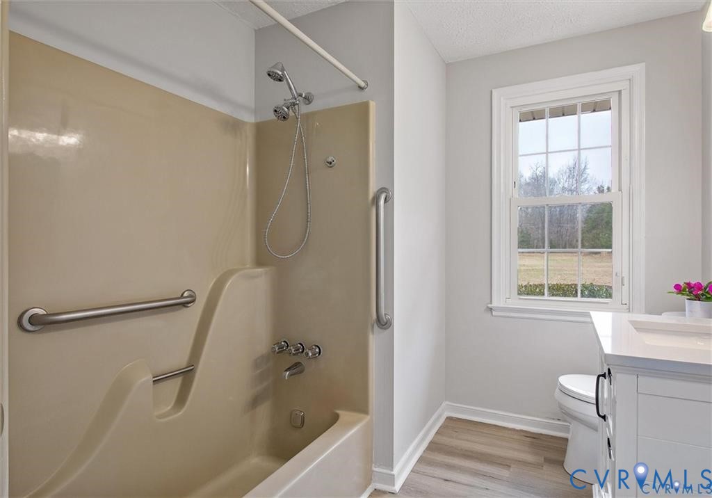 4192 Range Road Mechanicsville, VA 23111 - Photo 20 of 36 a bathroom with a granite countertop sink a toilet and shower
