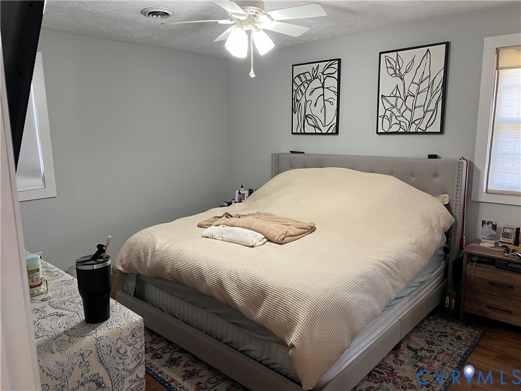 4192 Range Road Mechanicsville, VA 23111 - Photo 26 of 36 a bedroom with a bed and wall painting