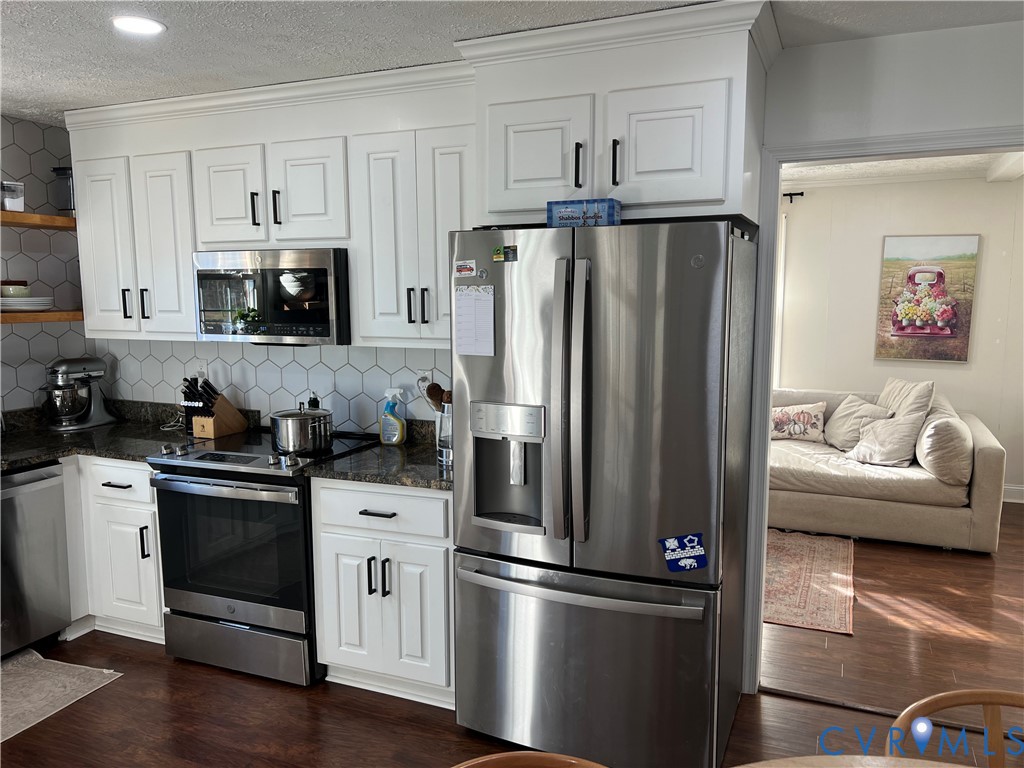 4192 Range Road Mechanicsville, VA 23111 - Photo 10 of 36 a kitchen with stainless steel appliances and refrigerator