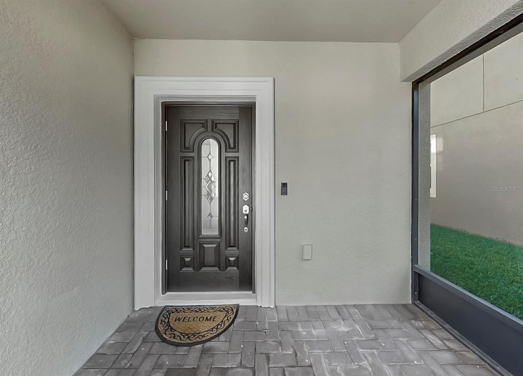 10012 Newminster Loop Ruskin, FL 33573 - Photo 2 of 59 a view of a entryway door of the house