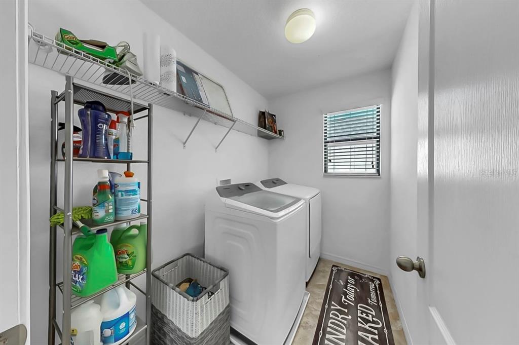 10012 Newminster Loop Ruskin, FL 33573 - Photo 36 of 59 a utility room with dryer and washer