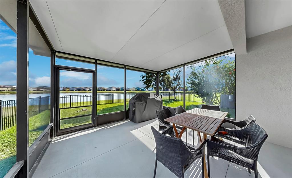 10012 Newminster Loop Ruskin, FL 33573 - Photo 37 of 59 a view of a porch with furniture and garden