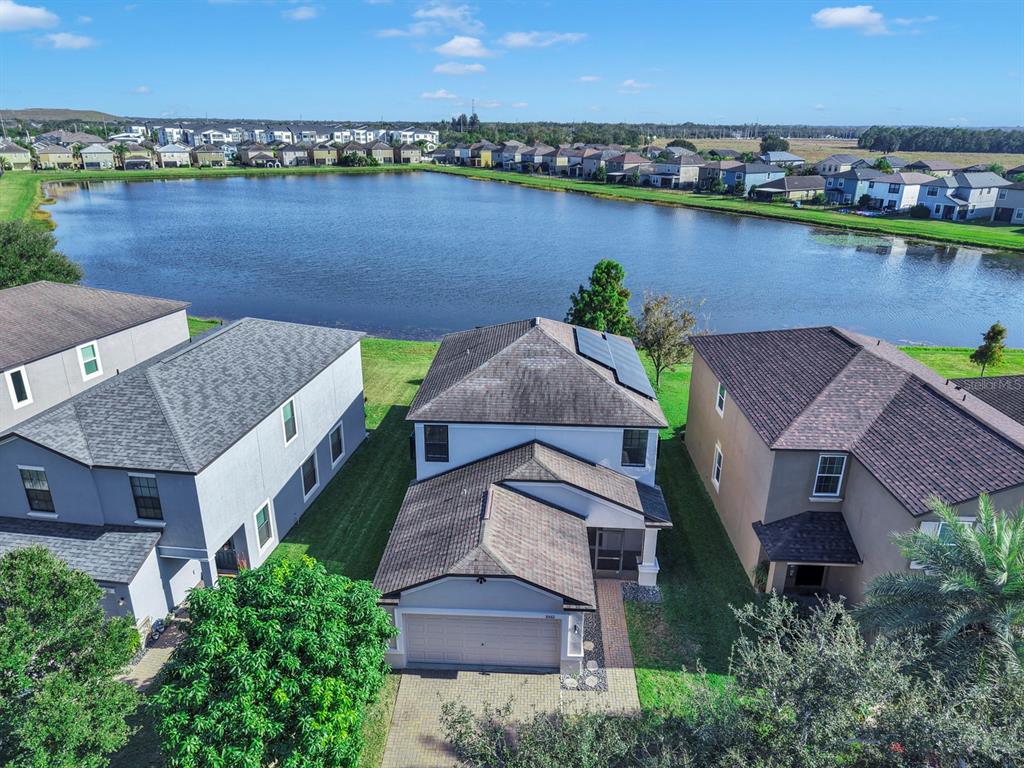 10012 Newminster Loop Ruskin, FL 33573 - Photo 47 of 59 an aerial view of a house with a lake view and a ocean view