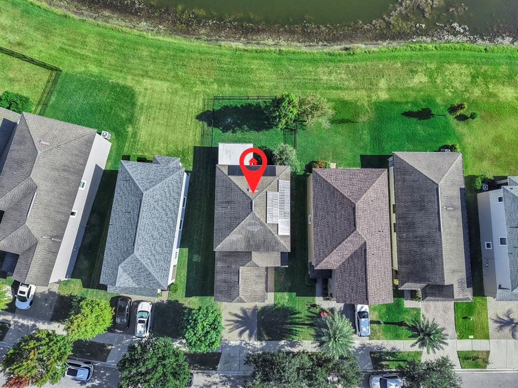 10012 Newminster Loop Ruskin, FL 33573 - Photo 49 of 59 an aerial view of a house with big yard and large tree