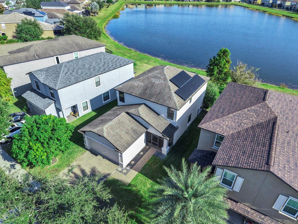 10012 Newminster Loop Ruskin, FL 33573 - Photo 53 of 59 an aerial view of a house with a garden and plants