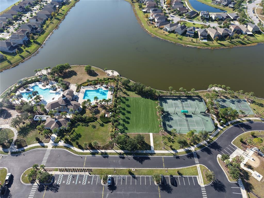 10012 Newminster Loop Ruskin, FL 33573 - Photo 59 of 59 an aerial view of a house with a lake view