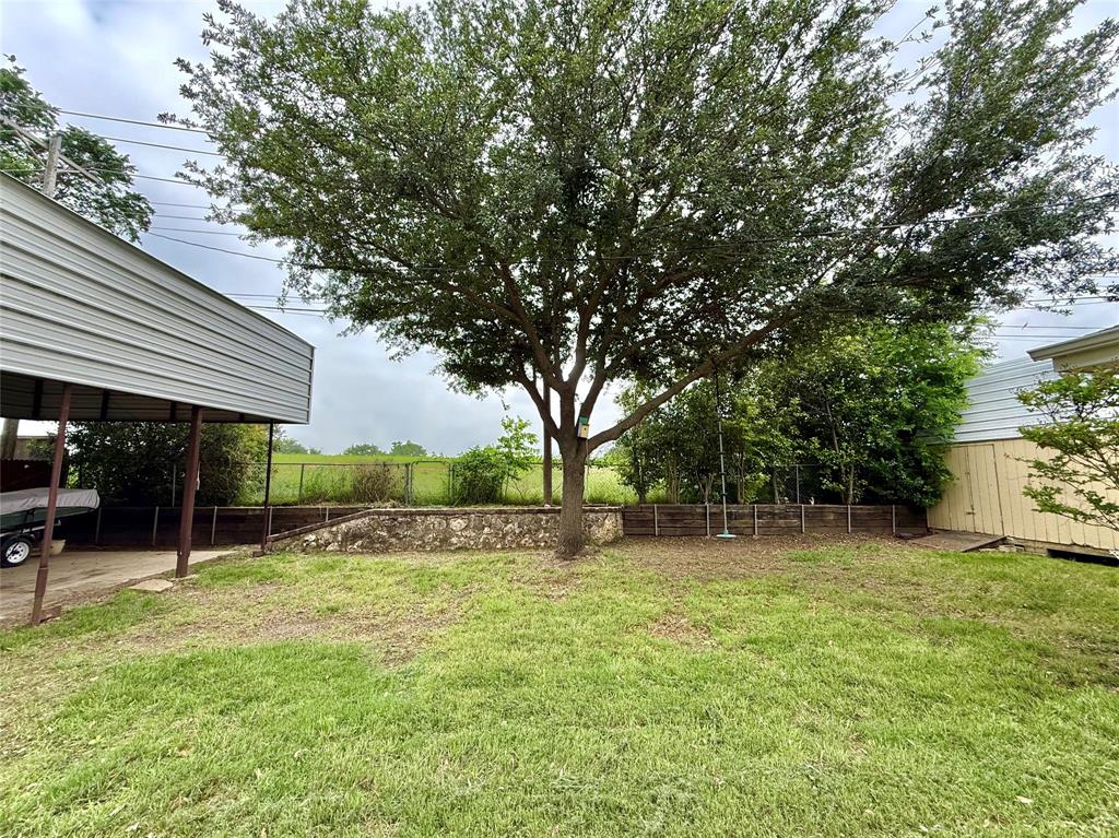1206 Mildred Lane Benbrook, TX 76126 - Photo 34 of 38 backing up to greenbelt with wild grapes along the fence line