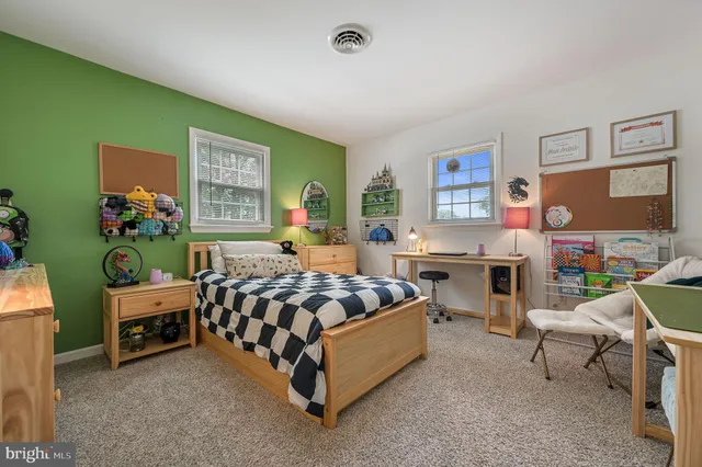 a bed room with furniture and a window