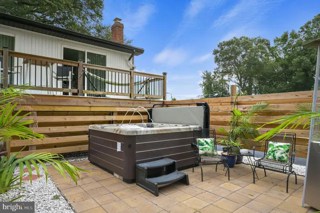a view of a patio with a table and chairs