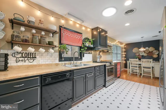 a kitchen with lots of counter top space and dining table