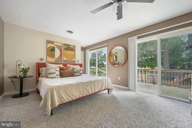 a bed room with a bed and a large window