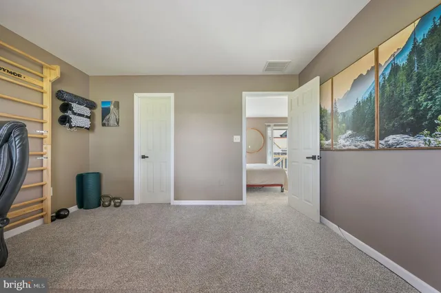a view of a livingroom with furniture and a window
