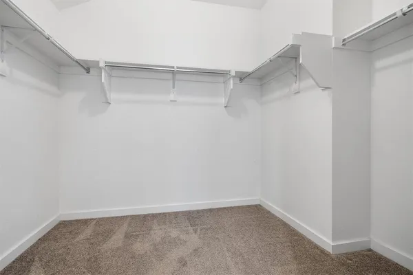 a view of an empty walk in closet