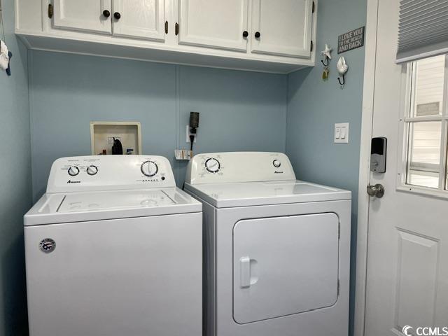 469 Sandpebble Surfside Beach, SC 29575 - Photo 2 of 39 Laundry area featuring cabinet space, washing machine and dryer, and healthy amount of natural light