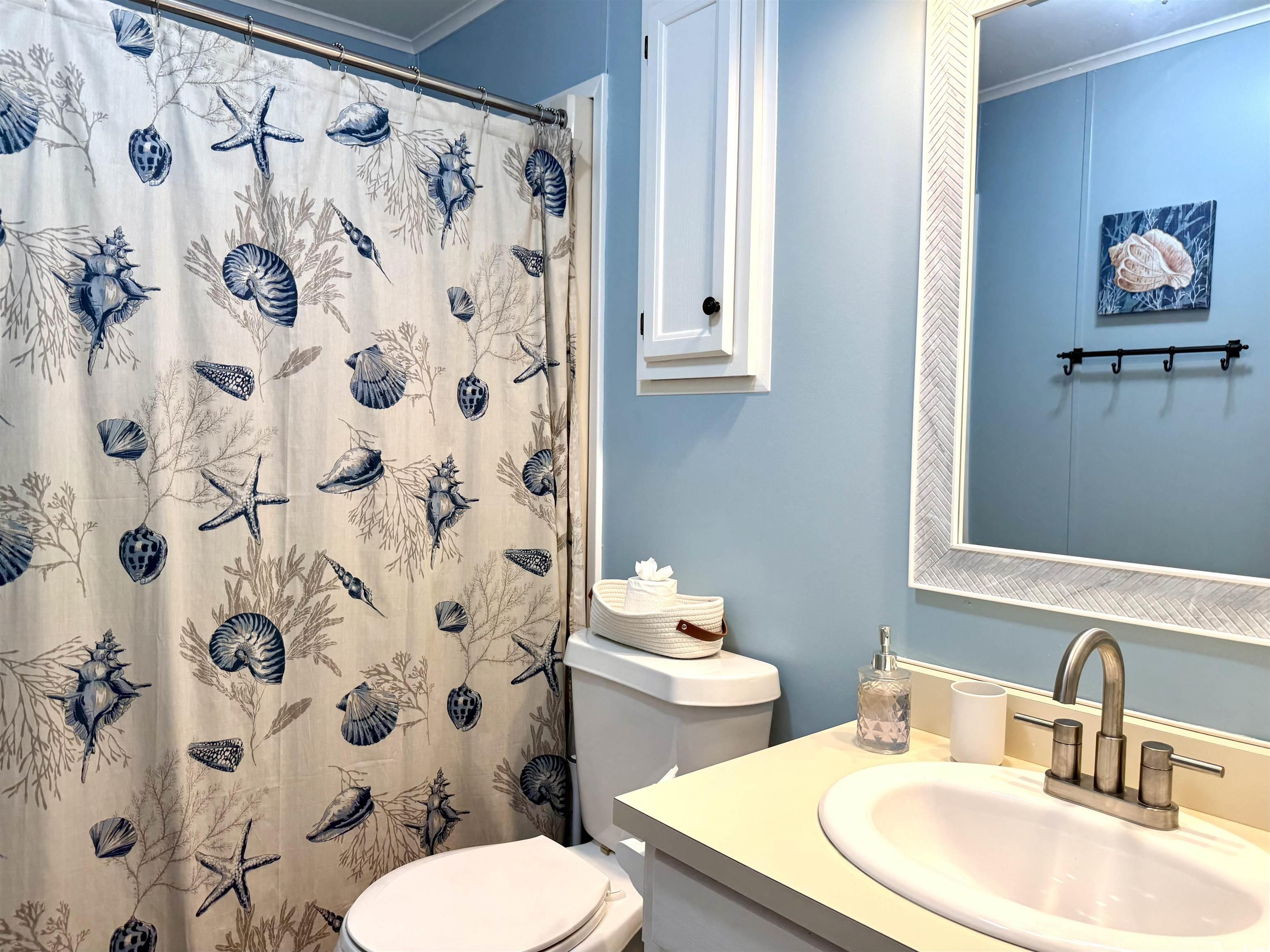 469 Sandpebble Surfside Beach, SC 29575 - Photo 23 of 39 Full bathroom featuring vanity, crown molding, and curtained shower