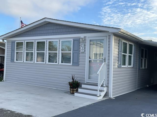 469 Sandpebble Surfside Beach, SC 29575 - Photo 28 of 39 View of side of home with entry steps and driveway