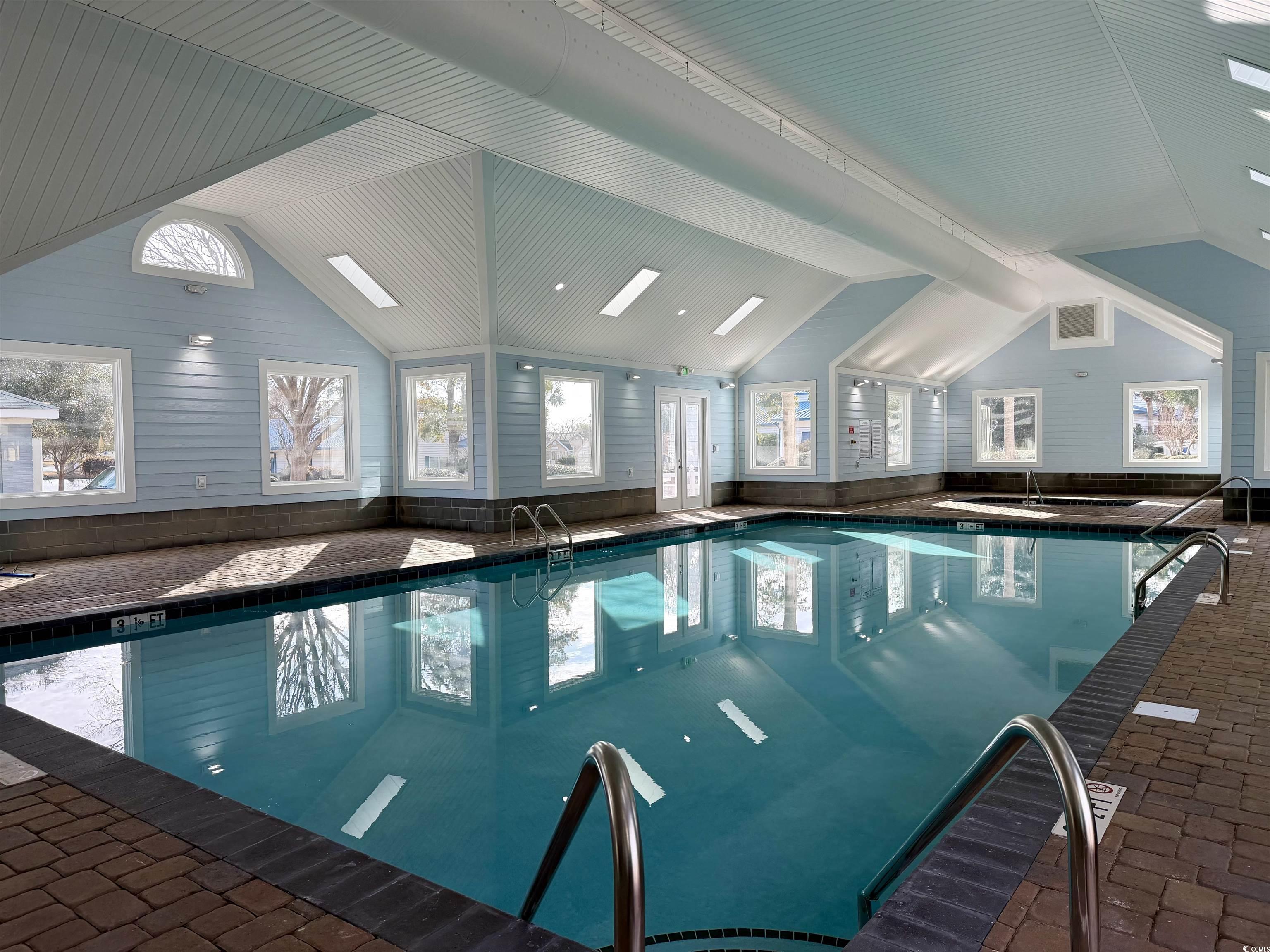 469 Sandpebble Surfside Beach, SC 29575 - Photo 29 of 39 Indoor pool featuring a sink and a skylight
