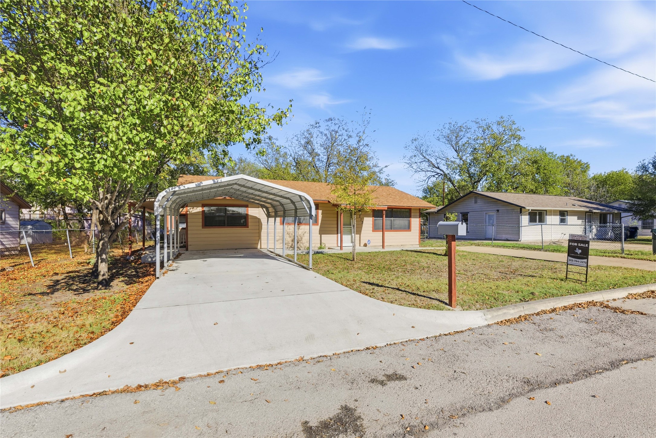 213 Ebony Street San Marcos, TX 78666 - Photo 1 of 1 a front view of house with a yard and trees