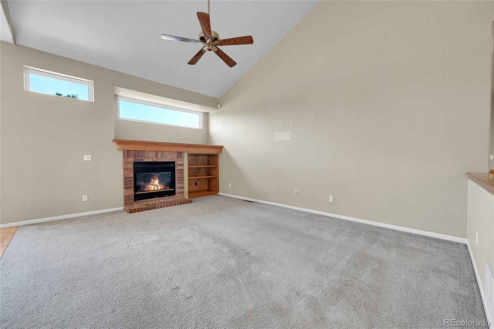 19115 East Belleview Place Centennial, CO 80015 - Photo 12 of 47 a view of an empty room with fire place