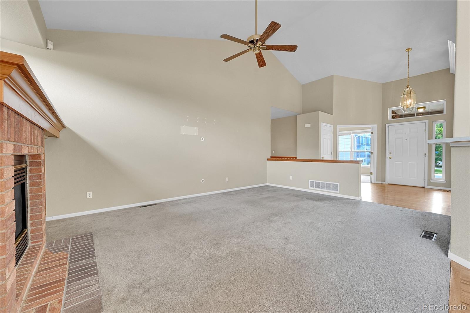 19115 East Belleview Place Centennial, CO 80015 - Photo 14 of 47 a view of a kitchen with a sink and a refrigerator