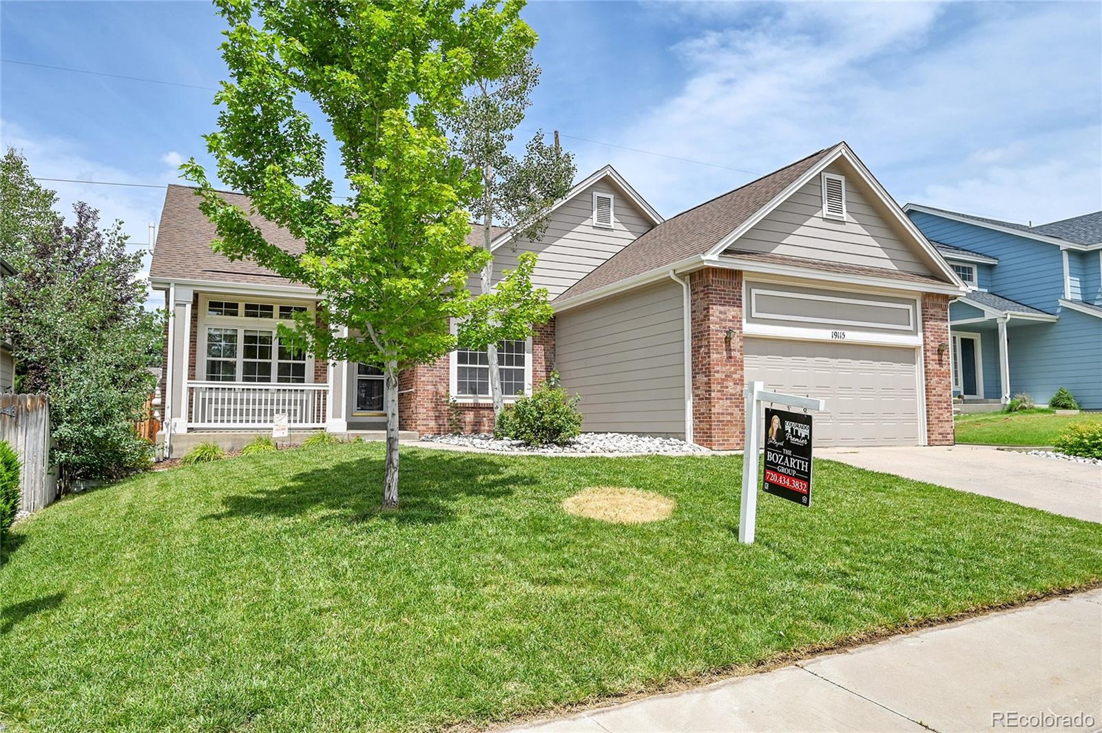 19115 East Belleview Place Centennial, CO 80015 - Photo 45 of 47 a view of a house with a yard and sitting area