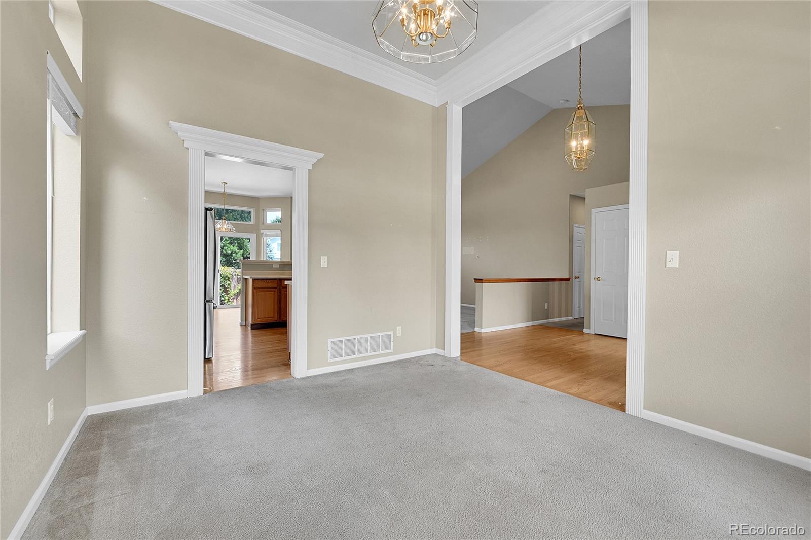 19115 East Belleview Place Centennial, CO 80015 - Photo 9 of 47 an empty room with kitchen view and bathroom view