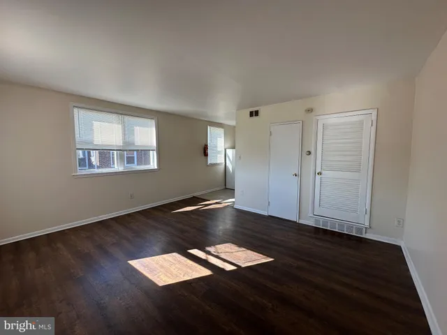 a view of workspace with wooden floor and window
