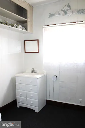 a white toilet sitting next to a bathroom sink