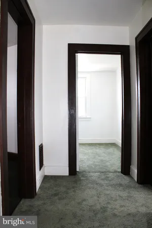 a picture of a room with a floor to ceiling window